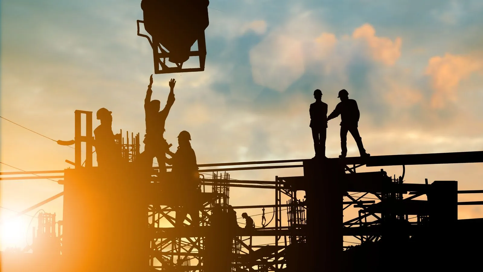 Construction workers on site silhouette 