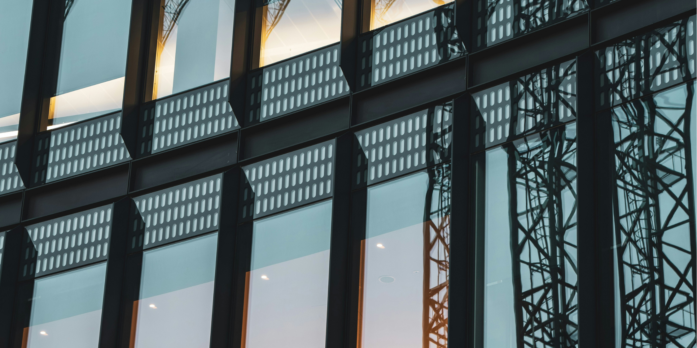 Image of building in London, UK, with reflection of crane 